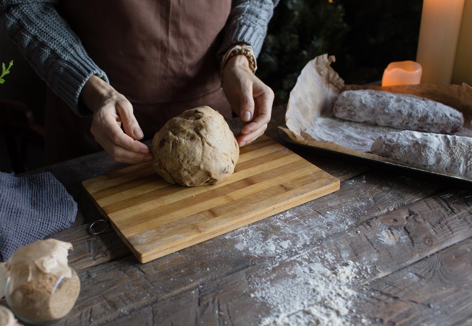 Hands shaping dough
